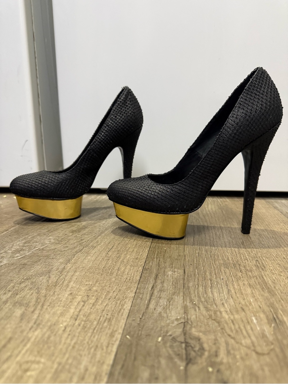 Fergie Black Textured Platform Pumps with Gold Platform